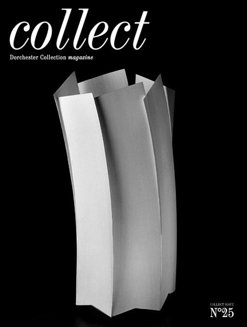 这期《收藏》杂志的封面是一张白色的、卡片式的、厨师帽式的折纸